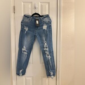 Fashion nova distressed high rise jeans.